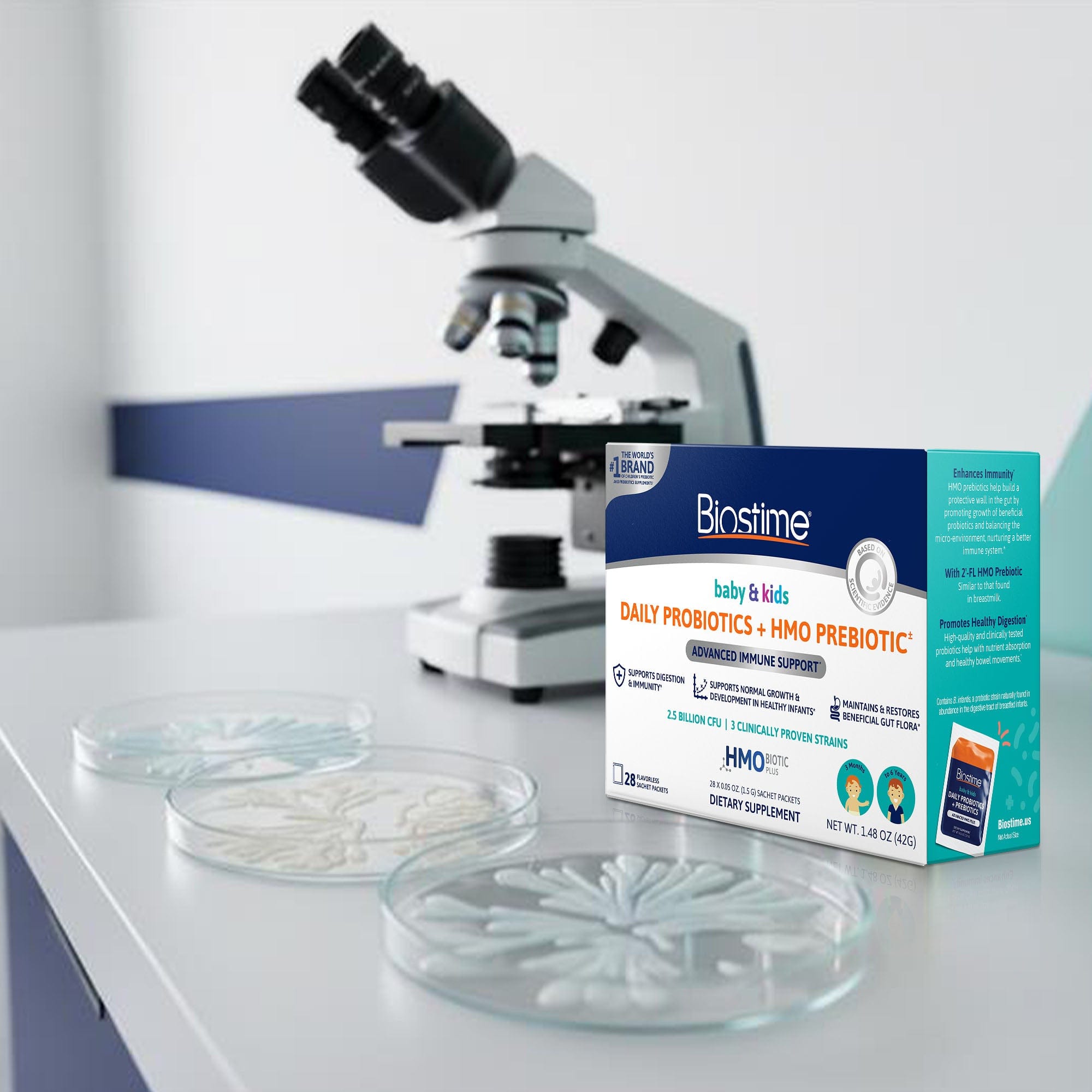 Biostime probiotic package with a microscope and petri dishes on a lab bench.